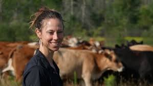 Amber Payne tends to her cows at her farm, Arc Acres, in Greely, south of Ottawa. (Laura Osman/CBC)